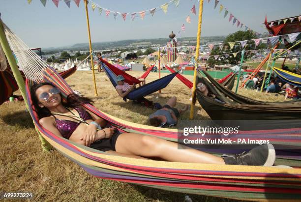 Imogen D'cruz from York in the Hammock Area during the Glastonbury Festival at Worthy Farm in Pilton, Somerset.