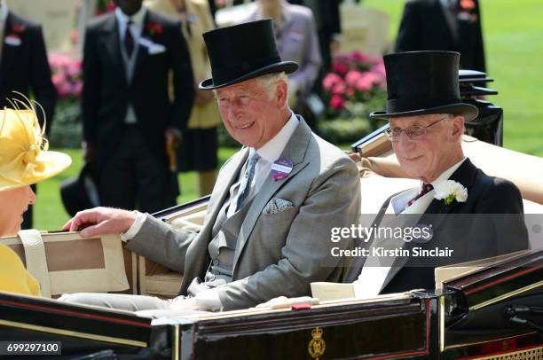 Queen Elizabeth II, Prince Charles, Prince of Wales and Lord Fellowes enter the parade ring during the Royal Processionon day 2 of Royal Ascot at...