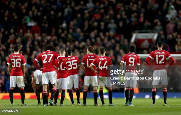 Manchester United players during the penalty shoot-out