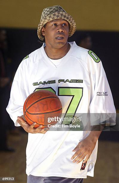 Rapper Master P takes a moment to shoot some hoops at Orr High School February 7, 2002 in Chicago, IL. The singer and fellow rapper Lil Romeo came to...