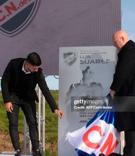 Uruguayan footballer Luis Suarez and club president Jose Luis Rodriguez participates in the inauguration of a football pitch with his name at Los...