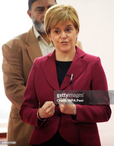 Scotland's First Minister and Scottish National Party leader Nicola Sturgeon meets worshippers during a visit to Dundee Central Mosque on June 21,...