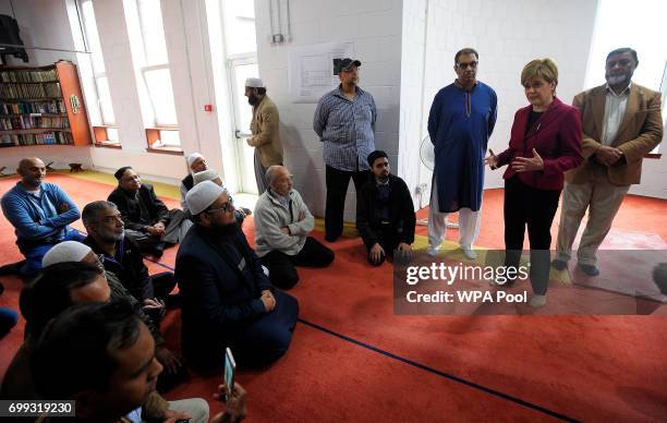 Scotland's First Minister and Scottish National Party leader Nicola Sturgeon meets worshippers during a visit to Dundee Central Mosque on June 21,...