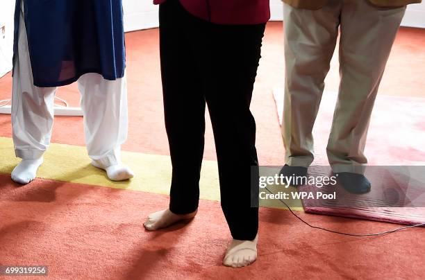 Scotland's First Minister and Scottish National Party leader Nicola Sturgeon meets worshippers during a visit to Dundee Central Mosque on June 21,...