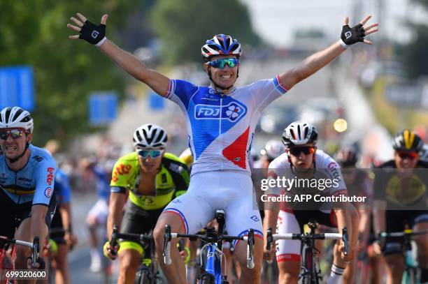 French cyclist Arnaud Demare of FDJ celebrates on the finish line after winning the 70th edition of the Halle-Ingooigem cycling race, a UCI 1-1...