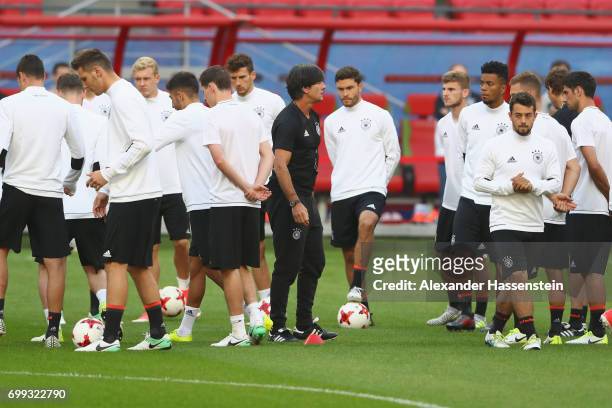 Jochim Loew, head coach of team Germany talks to his players prior to a team Germany training session at Kazan Arena on June 21, 2017 in Kazan,...