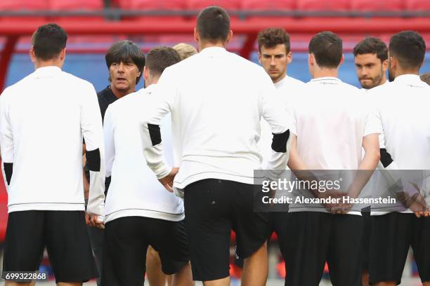 Jochim Loew, head coach of team Germany talks to his players prior to a team Germany training session at Kazan Arena on June 21, 2017 in Kazan,...