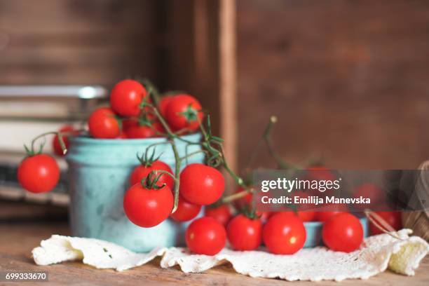 fresh cherry tomatoes on wooden table - cherry tomato stock pictures, royalty-free photos & images