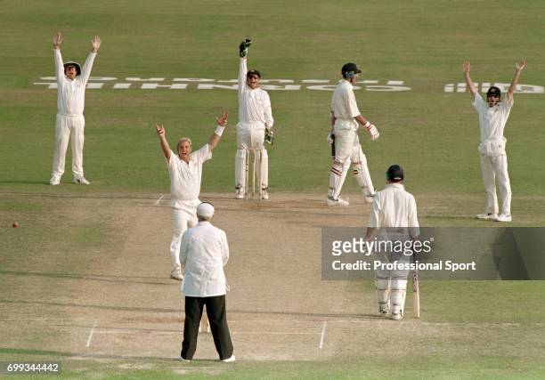 Shane Warne of Australia gets the wicket of England batsman Ben Hollioake for 2 runs during the 5th Test match between England and Australia at Trent...