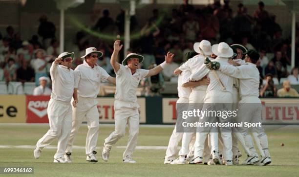 Australia's Mark Taylor, Mark Waugh and Shane Warne go to celebrate with the rest of the team after Australia win the 5th Test match between England...