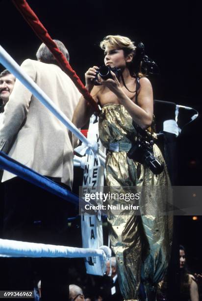 Welterweight Title: SI Swimsuit model Christie Brinkley photographs the fight from ringside seat during Sugar Ray Leonard vs Roberto Duran bout at...