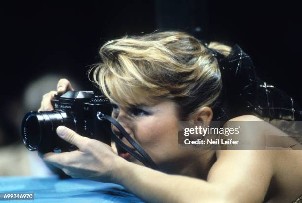 Welterweight Title: SI Swimsuit model Christie Brinkley photographs the fight from ringside seat during Sugar Ray Leonard vs Roberto Duran bout at...