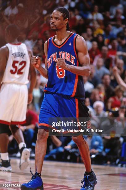Latrell Sprewell of the New York Knicks pumps his fists as he walks up the court during the 2000 NBA Eastern Conference Semifinals against the Miami...