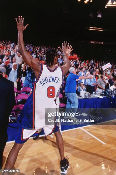 Latrell Sprewell of the New York Knicks celebrates with the crowd after winning the 1999 NBA Eastern Conference Finals against the Indiana Pacers at...