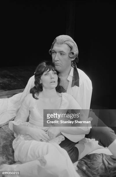 English comic actor Bernard Bresslaw with actress Caroline Mortimer in a scene from the play 'The Silence of St Just' by Michael Hastings, at the...