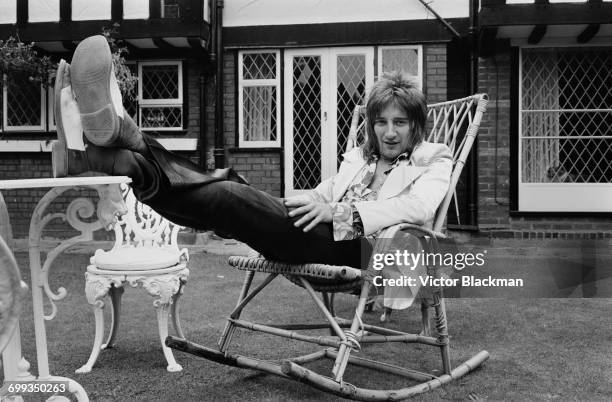 British rock singer Rod Stewart lounging in the garden, UK, 12th September 1971.