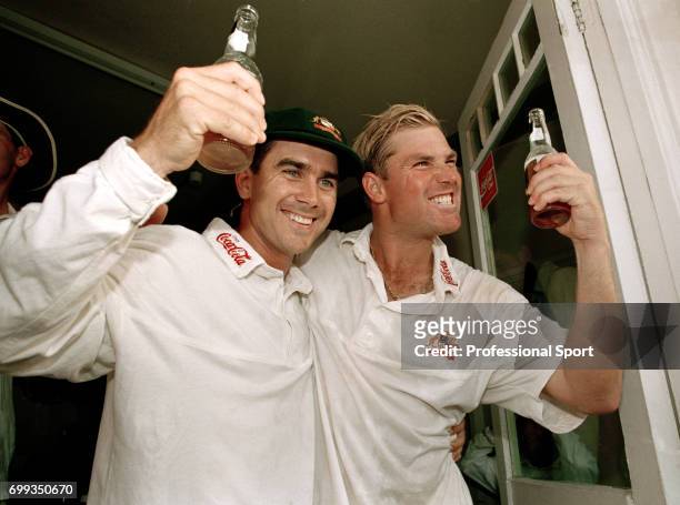Australia's Justin Langer and Shane Warne celebrate winning the 5th Test match between England and Australia by 264 runs giving them an unassailable...