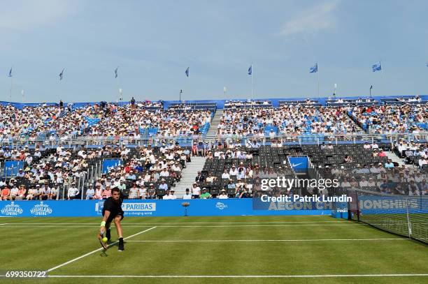 Grigor Dimitrov of Bulgaria reach for a forehand during the 2nd round match against Julien Benneteau of France on day three at Queens Club on June...