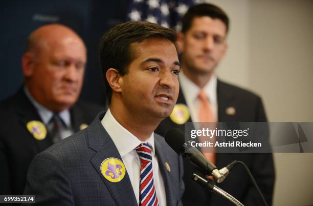 Rep. Carlos Curbelo , flanked by U.S. Rep. Glenn Thompson and U.S. Speaker of the House Rep. Paul Ryan , speaks during a press conference on Capitol...