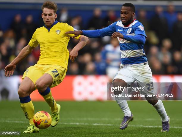 Leeds United's Charlie Taylor clears the ball under pressure from Queens Park Rangers' David Hoilett