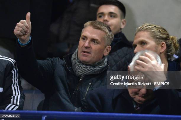 Brentford's newly appointed manager Dean Smith watches the game from the stands.