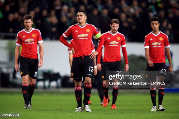 Manchester United's Michael Carrick, Chris Smalling, Nick Powell and Cameron Borthwick-Jackson stand dejected after the final whistle