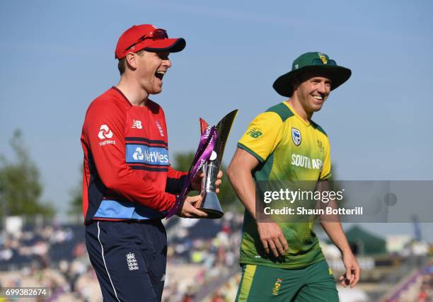 England captain Eoin Morgan shares a joke with South Africa captain AB de Villiers after posing with the trophy before the 1st NatWest T20...