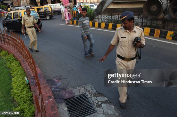 Police inspects at the accident spot outside BMC head office opposite CST railway station in Mumbai on Friday R.K. Ramchandran was knocked down by...