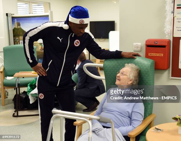 Reading's Aaron Tshibola talks to a patient during a visit to The Royal Berkshire Hospital in Reading