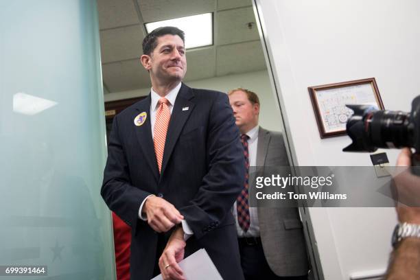 Speaker of the House Paul Ryan, R-Wis., arrives for a news conference in the Capitol after a meeting of the House Republican Conference on June 21,...