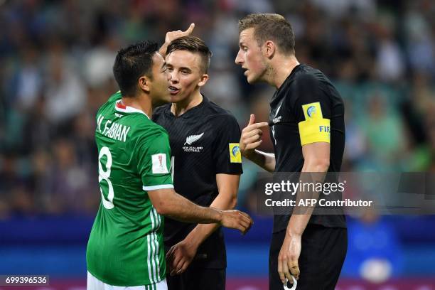 Mexico's forward Marco Fabian argues with New Zealand's midfielder Ryan Thomas and New Zealand's forward Chris Wood during the 2017 Confederations...