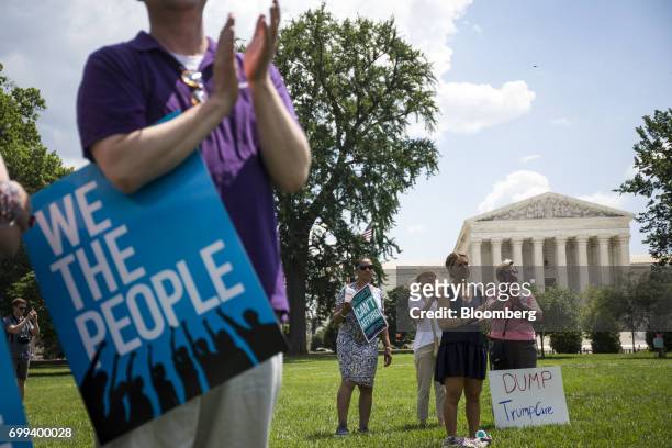 Demonstrators hold signs during a healthcare rally opposing the American Health Care Act bill on Capitol Hill in Washington, D.C., U.S., on...
