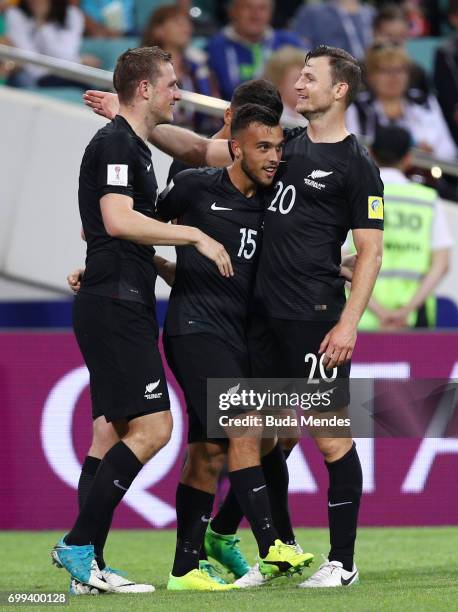 Chris Wood of New Zealand celebrates scoring his sides first goal with Clayton Lewis of New Zealand and Tommy Smith of New Zealand during the FIFA...