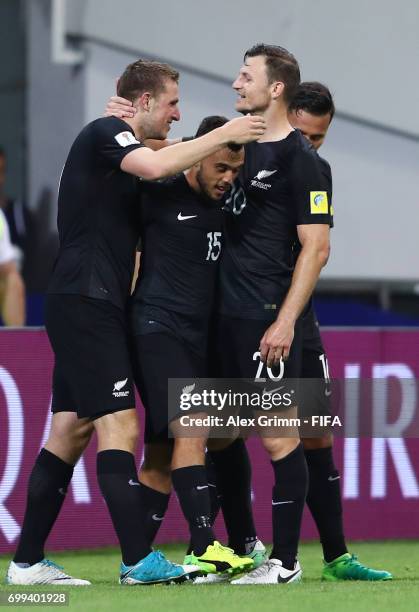 Chris Wood of New Zealand celebrates scoring his sides first goal with Clayton Lewis of New Zealand and Tommy Smith of New Zealand during the FIFA...