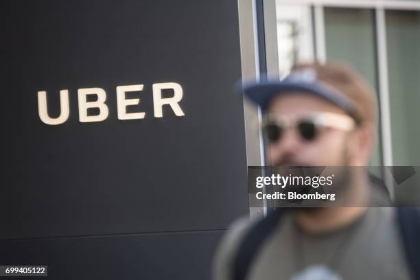 Pedestrian walks past the Uber Technologies Inc. Headquarters building in San Francisco, California, U.S., on Wednesday, June 21, 2017. Travis...