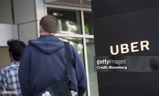 People arrive at the Uber Technologies Inc., headquarters in San Francisco, California, U.S., on Wednesday, June 21, 2017. Travis Kalanick has...
