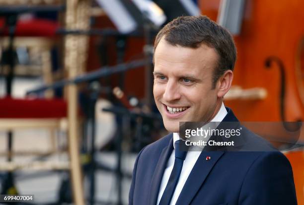 French President Emmanuel Macron attends the "Fete de la musique" during the visit of Colombian President, Juan Manuel Santos and his wife Maria...