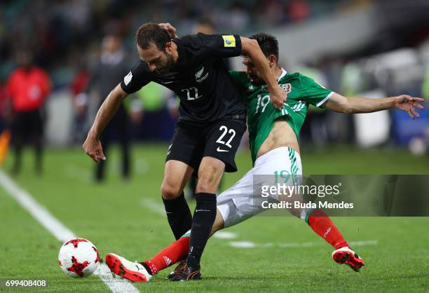 Andrew Durante of New Zealand and Oribe Peralta of Mexico battle for possession during the FIFA Confederations Cup Russia 2017 Group A match between...