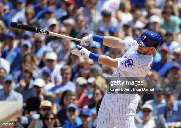 Ian Happ of the Chicago Cubs hits a two run home run in the 4th inning against the San Diego Padres at Wrigley Field on June 21, 2017 in Chicago,...