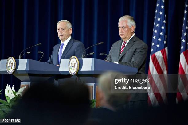 James Mattis, U.S. Secretary of defense, left, speaks as Rex Tillerson, U.S. Secretary of State, listens during a news conference following the...
