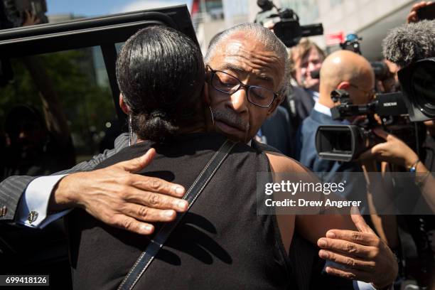 Rev. Al Sharpton hugs Ellisha Garner following a press conference after meeting with Department of Justice officials, June 21, 2017 in the Brooklyn...