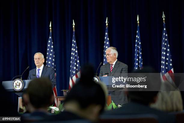 James Mattis, U.S. Secretary of defense, left, speaks as Rex Tillerson, U.S. Secretary of State, listens during a news conference following the...