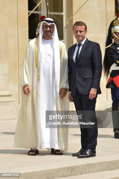 French President Emmanuel Macron receives Abu Dhabi's Crown Prince Sheikh Mohammed Bin Zayed Al Nahyan at Elysee Palace on June 21, 2017 in Paris,...