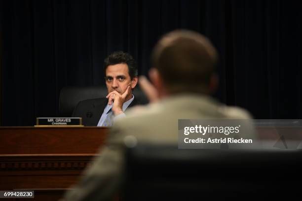 House Appropriations Committee's Financial Services and General Government Subcommittee Chairman Tom Graves listens to OMB Director Mick Mulvaney...