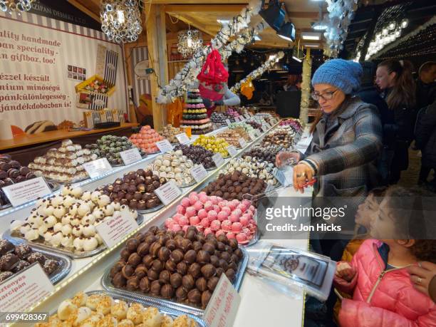 candy stall in a budapest christmas market. - christmas atmosphere in budapest stock pictures, royalty-free photos & images