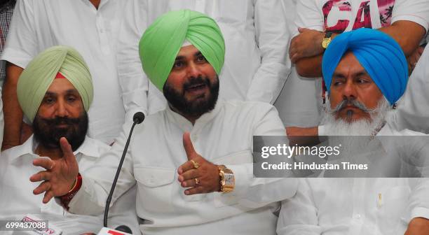 Punjab Cabinet Minister Navjot Singh Sidhu along with other leaders during a press conference at Punjab Vidhan Sabha Session on June 21, 2017 in...