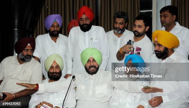 Punjab Cabinet Minister Navjot Singh Sidhu along with other leaders during a press conference at Punjab Vidhan Sabha Session on June 21, 2017 in...