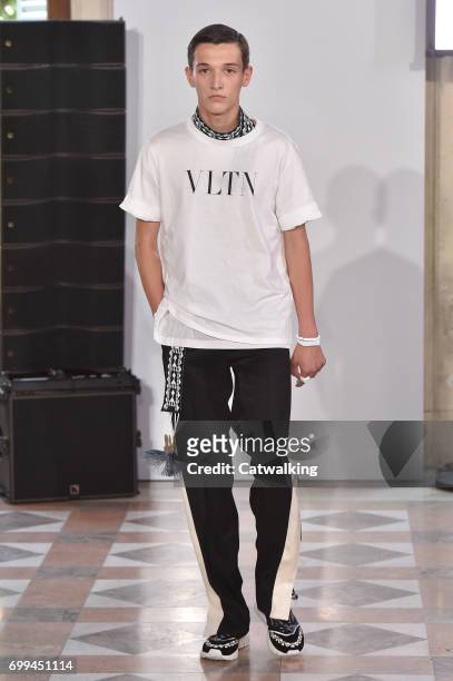Model walks the runway at the Valentino Spring Summer 2018 fashion show during Paris Menswear Fashion Week on June 21, 2017 in Paris, France.