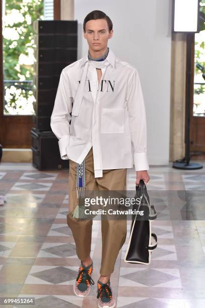 Model walks the runway at the Valentino Spring Summer 2018 fashion show during Paris Menswear Fashion Week on June 21, 2017 in Paris, France.