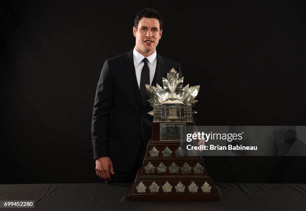 Sidney Crosby of the Pittsburgh Penguins poses for a portrait with the Conn Smythe Trophy at the 2017 NHL Awards at T-Mobile Arena on June 21, 2017...